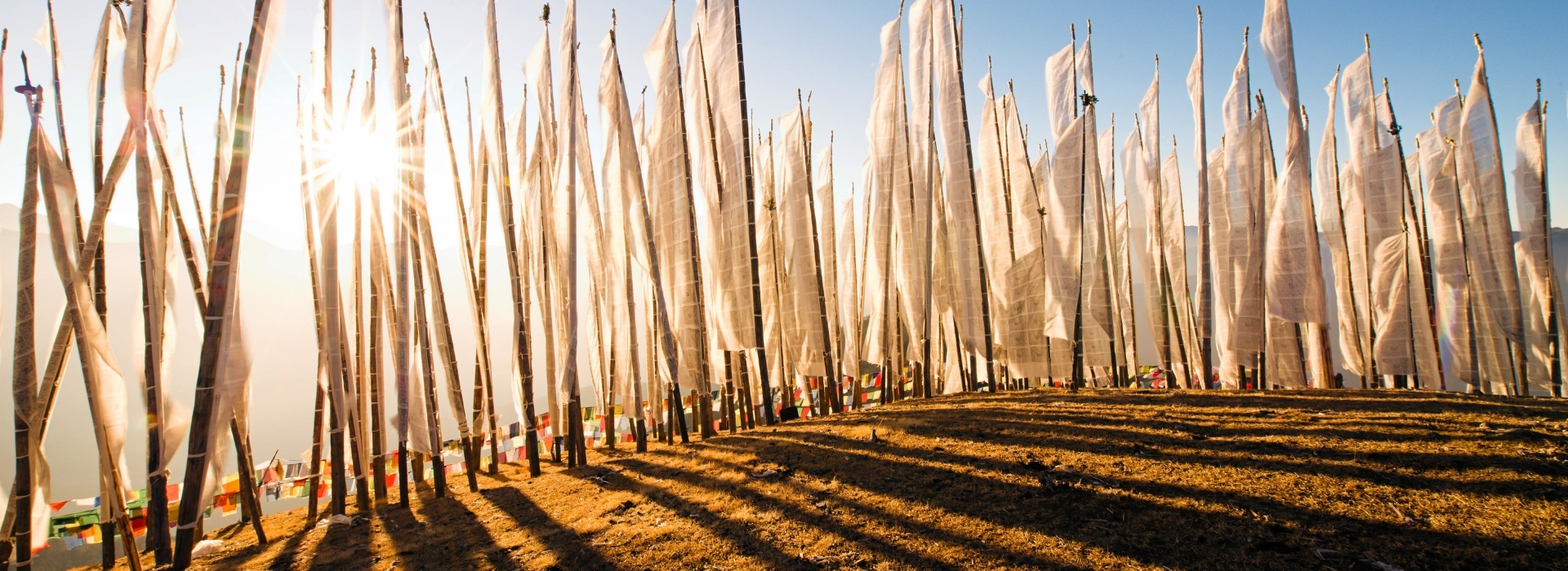 Prayer Flags at Bumdra White prayer flags at Bumdra overlooking the mountains of Bhutan